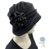 Alice wide from brim cloche hat for women handmade in black fleece with satin hydrangea brooch in shades of brown Boston Millinery modeled on a hat mannequin flower Side view