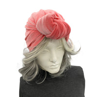 Coral color velvet knot turban shown on mannequin top view