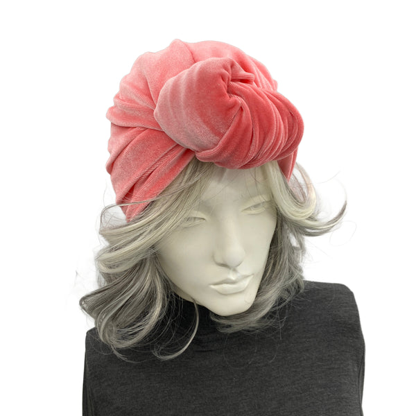 Coral color velvet knot turban shown on mannequin top view