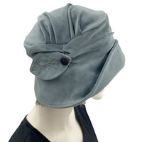 1920s style dusky blue cloche hat for women side view of leaf brooch shown modeled on a mannequin 