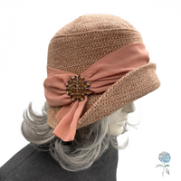 Dusky pink Amelia cloche side view shown on mannequin 