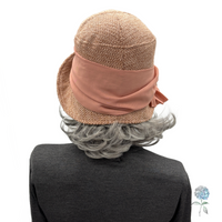Dusky pink Amelia cloche rear view shown on mannequin 