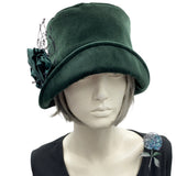 Eleanor narrow front brim cloche hat for women dark green velvet with green flowers and wide hole black net brooch front view from Boston Millinery
