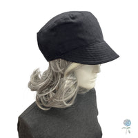 Black linen cadet cap side view modeled on a mannequin
