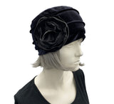 Velvet Cloche Hat and Chemo Headwear in black with Satin Flower Embellishment modeled on a hat mannequin side view with flower