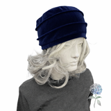 navy blue velvet chemo cloche on white mannequin
