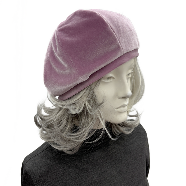 Handmade pale mauve velvet beret in a classic eight-panel design displayed on a mannequin with gray hair, stylish and vintage-inspired.