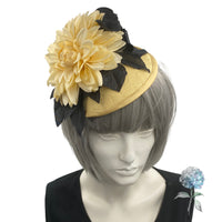 yellow and black flower fascinator shown modeled on a mannequin head top front view