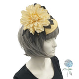 yellow and black flower fascinator shown modeled on a mannequin head side view