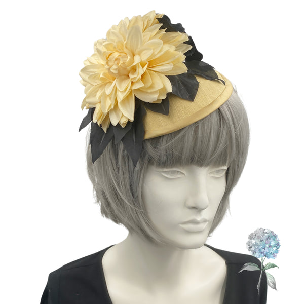 yellow and black flower fascinator shown modeled on a mannequin head 