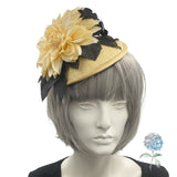yellow and black flower fascinator shown modeled on a mannequin head front view