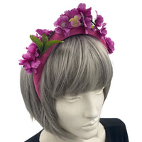 purple pink cherry blossom fascinator headband modeled on a mannequin 