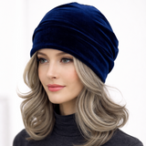 Woman wearing a blue turban on a white background