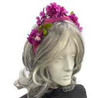 purple pink cherry blossom fascinator headband modeled on a mannequin 