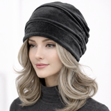 Woman wearing a gray beanie on a white background