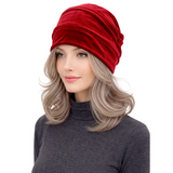 Woman wearing a red headscarf on a white background