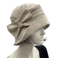 1920s Style cloche hat handmade in black linen with linen bow brooch side view  Boston Millinery handmade beige linen