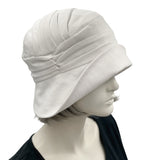 Alice Cloche hat for women handmade in white linen top side view. Modeled on a hat mannequin. Boston Millinery 