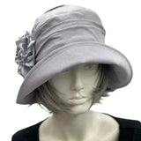 Alice gray linen cloche hat with wide front brim handmade silky satin hydrangea petal brooch  front view