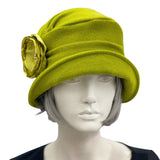 Alice narrow brim cloche hat women handmade in chartreuse color wool with a satin rose brooch  front view modeled on a hat mannequin