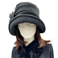 Alice wide front brim black fleece cloche with large  flower detail with Ostrich feather front view