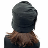 Alice wide front brim black fleece cloche with large  flower detail with Ostrich feather rear view