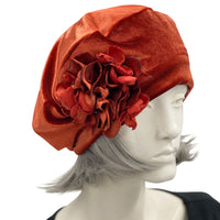 Rust velvet beret with a pretty hydrangea petal brooch handmade in velvet and satin. modelled on a hat manequin boston millinery 