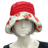 Boston Millinery 1920s style cloche hat handmade in red linen with floral print brim and bow. Front view