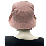 Betty cloche hat in dusky pink linen with pink cotton floral brim and bow rear view