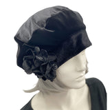 Black velvet beret with a pretty hydrangea petal brooch handmade in velvet and satin. modelled on a hat manequin boston millinery 