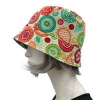 Small Brim Bucket Hat in Summer-weight Cotton green red orange vibrant print garden hat side view