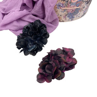 Large Eggplant or black color hydrangea petal brooch shown on a white background