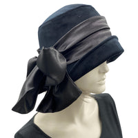1920s Style black velvet cloche hat with satin bow scarf modeled on a mannequin side view Handmade by Boston Millinery 