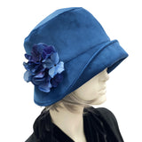 Blue velvet cloche Hat from Boston Millinery with hydrangea brooch side view on head mannequin 