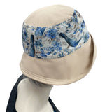 Floral SummerCloche Hat in Beige and Blue with a wide front brim side view Boston Millinery