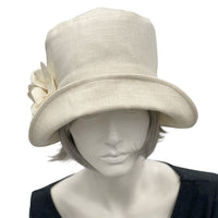 Eleanor Cream linen wide front brim cloche hat with hydrangea linen flower brooch  handmade Boston Millinery top front view