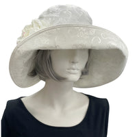 Eleanor Derby Brim damask fabric with large white peony brooch cloche hat women  front view