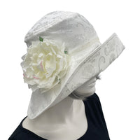 Eleanor Derby Brim damask fabric with large white peony brooch cloche hat women  side flower view