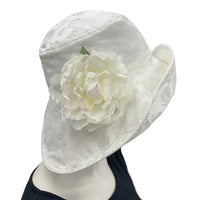 Eleanor Derby Brim damask fabric with large white peony brooch cloche hat women  side flower view