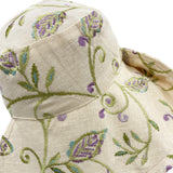Wide brim womens Derby hat in embroidered linen close up of fabric