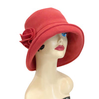 Boston Millinery's cozy winter cloche with an equidistant shape brim shown in brick red side view