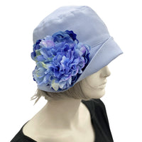 Eleanor cloche hat women Pale Blue linen with large peony brooch side flower view