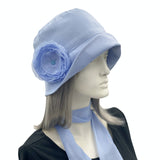 Eleanor narrow brim Pale blue linen with chiffon rose brooch Boston Millinery  side view