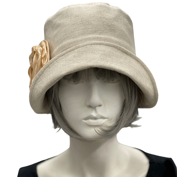 Linen 1920s Cloche Hats Eleanor style beige linen with beige chiffon rose brooch modeled on a hat mannequin 