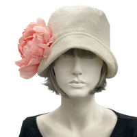 Eleanor small brim cream linen cloche hat with Peont Brooch in ribbon daisy brooch front view