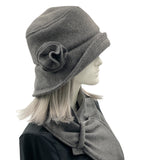 Eleanor cloche hat with equidistant brim handmade in gray fleece and modeled on a mannequin  side view
