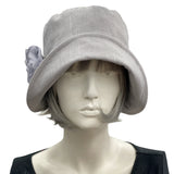 Linen 1920s Cloche Hats Eleanor style gray linen with gray chiffon rose brooch modeled on a hat mannequin 