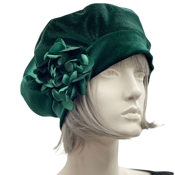 emerald green velv et beret with a pretty hydrangea petal brooch handmade in velvet and satin. modelled on a hat manequin boston millinery 