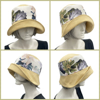 Yellow linen  Eleanor with wide front brim cloche  hat with floral band and large flower brooch how the hat looks worn without the brooch  Boston Millinery  