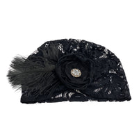 Black lace Turban Cocktail Hat with rhinestone flat lay view easy to pack